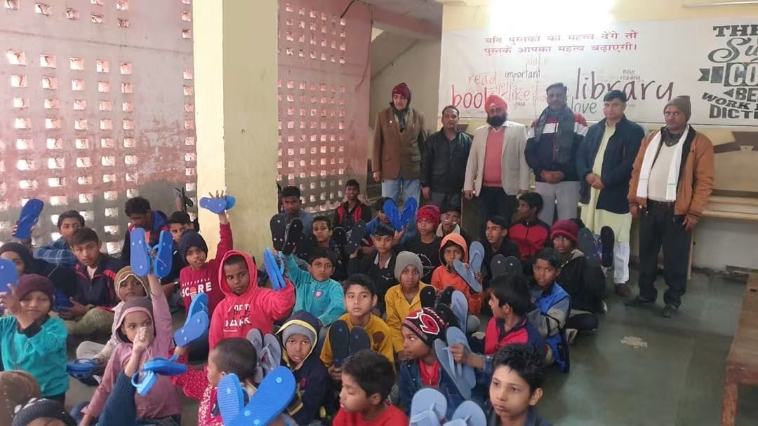 Children receiving footwear in a learning space